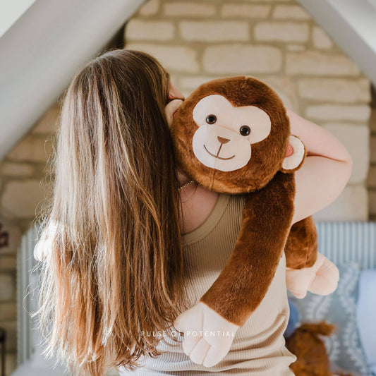 Woman hugging Marty the Monkey